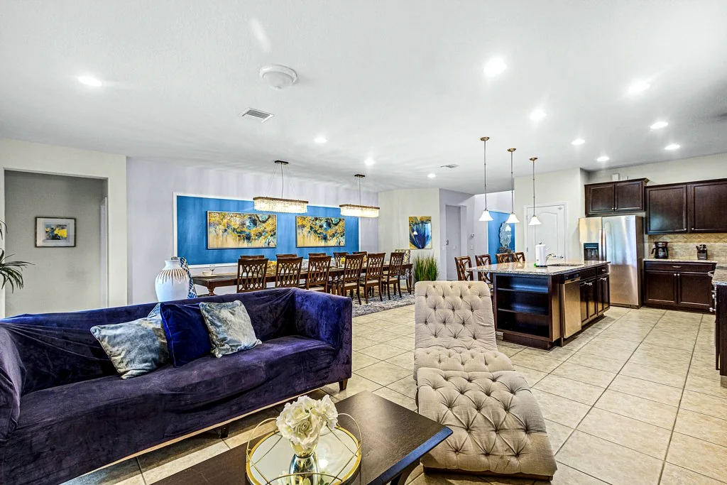Open living room, dining area and kitchen at Nice Palms